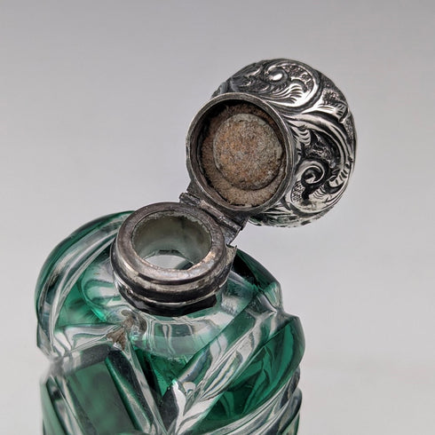 Antique British silver-lidded green cut glass portable perfume bottle